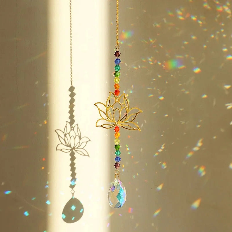 Lotus Crystal Sun Catcher hanging in a window, scattering rainbow light